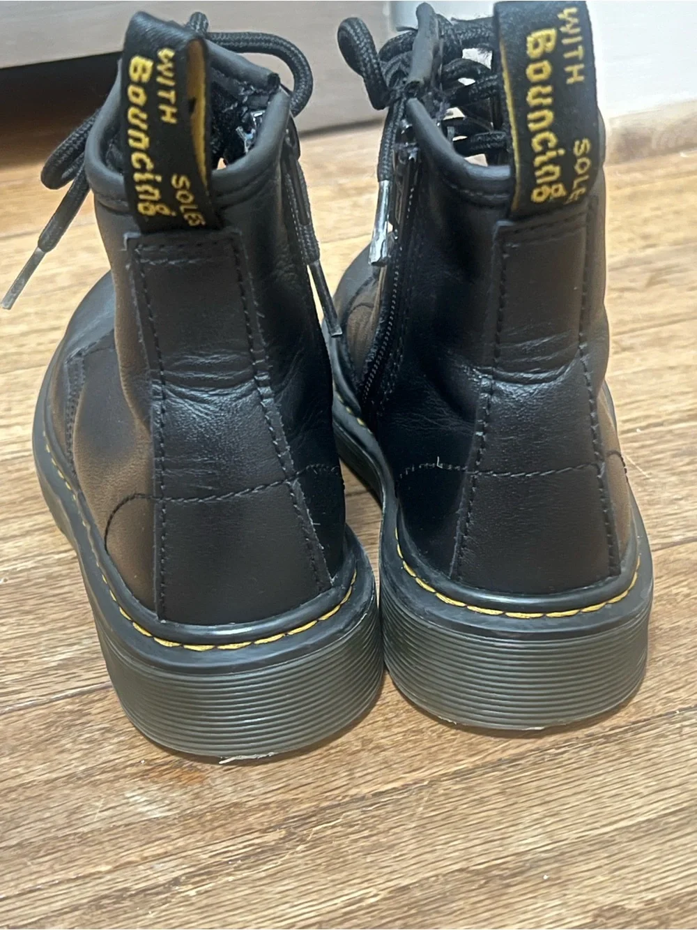Dr. Martens Black Lace-Up kids Combat Boots with Yellow Stitching